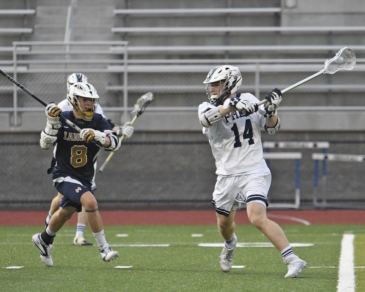Prep lax squad handles MC, climbs over .500